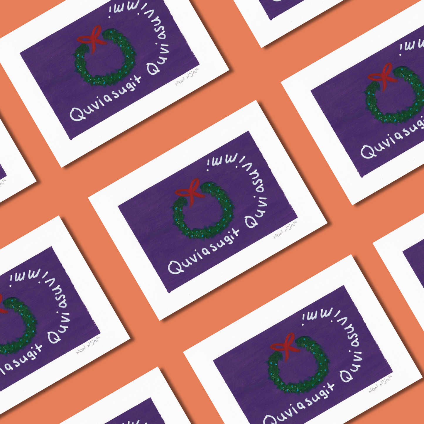 Multiple hand-painted ‘Quviasugit Quviasuvik’ cards arranged in a diagonal grid over a coral background. Each artwork features a green wreath with a red bow on a deep purple backdrop, encircled by the Inuktitut phrase ‘Quviasugit Quviasuvik,’ meaning ‘Merry Christmas.’ The repetition creates a warm, festive pattern celebrating joy and connection.